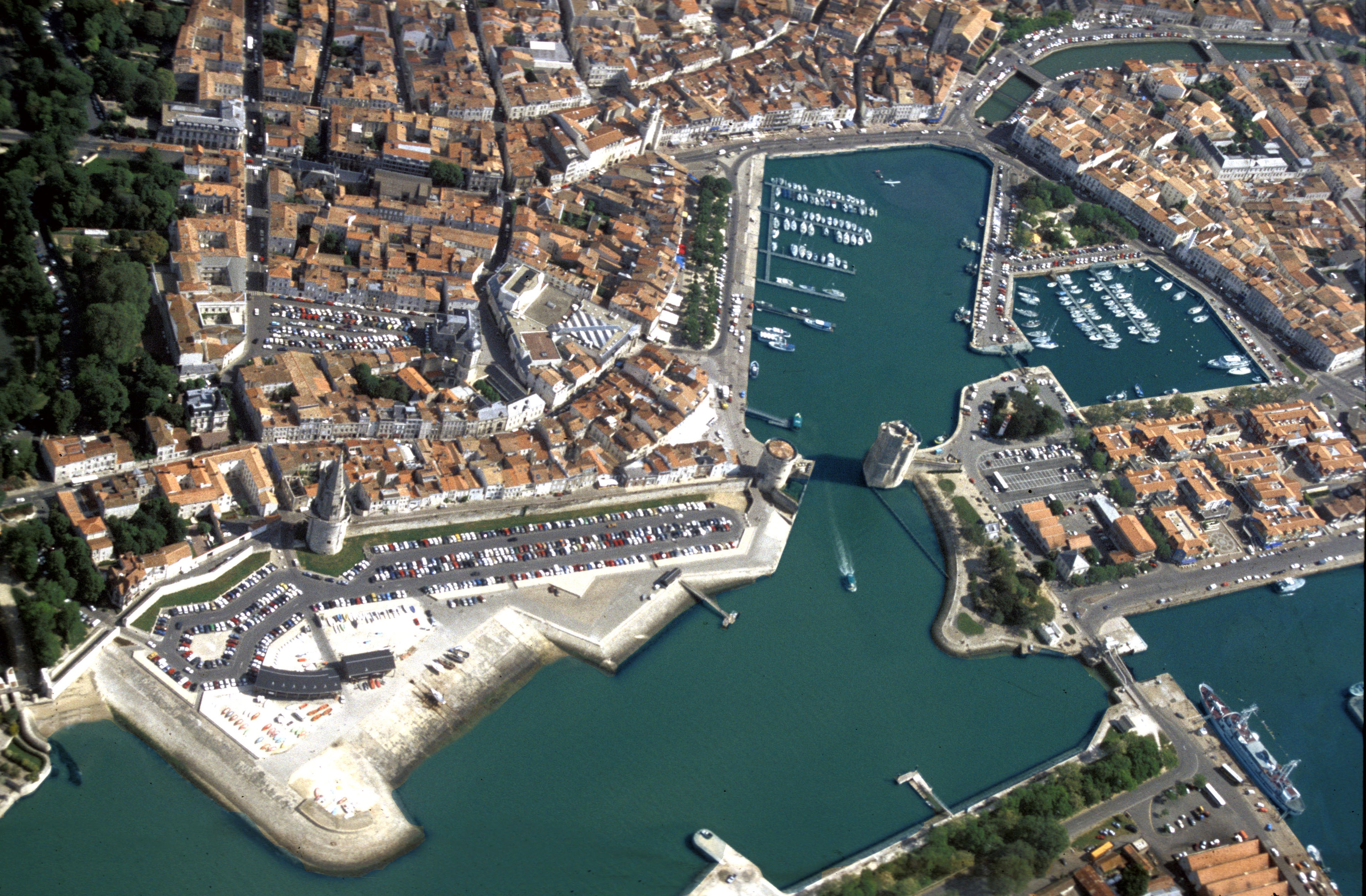 Aerial view of a coastal town with a harbor
